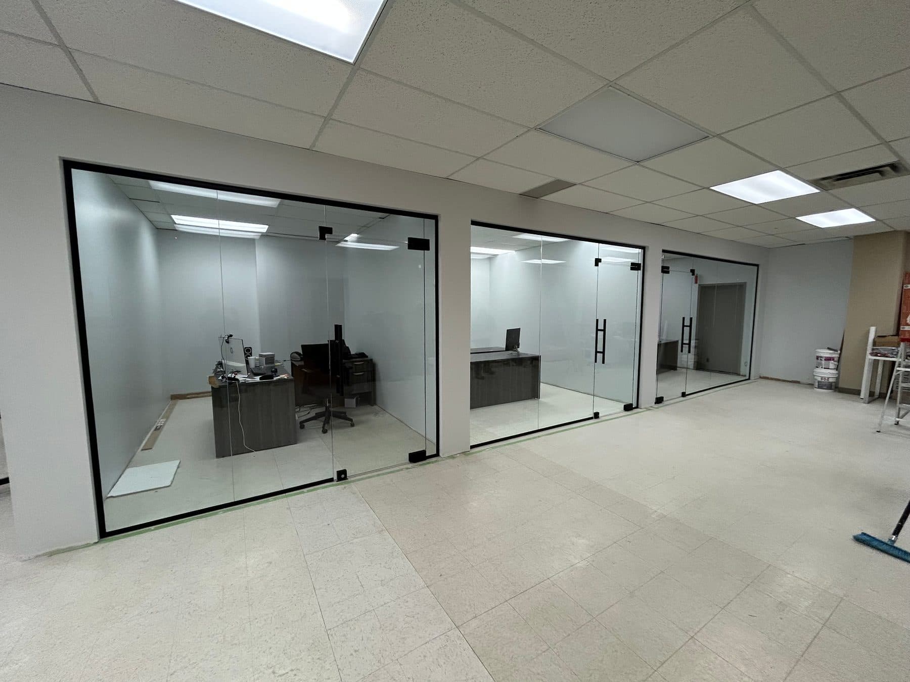 Private offices closed with black-frame glass partitions