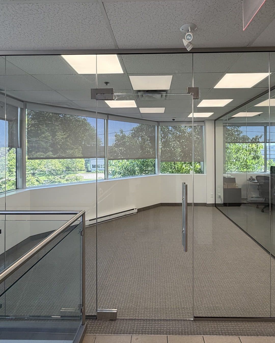 Full-height glass door in an office partition